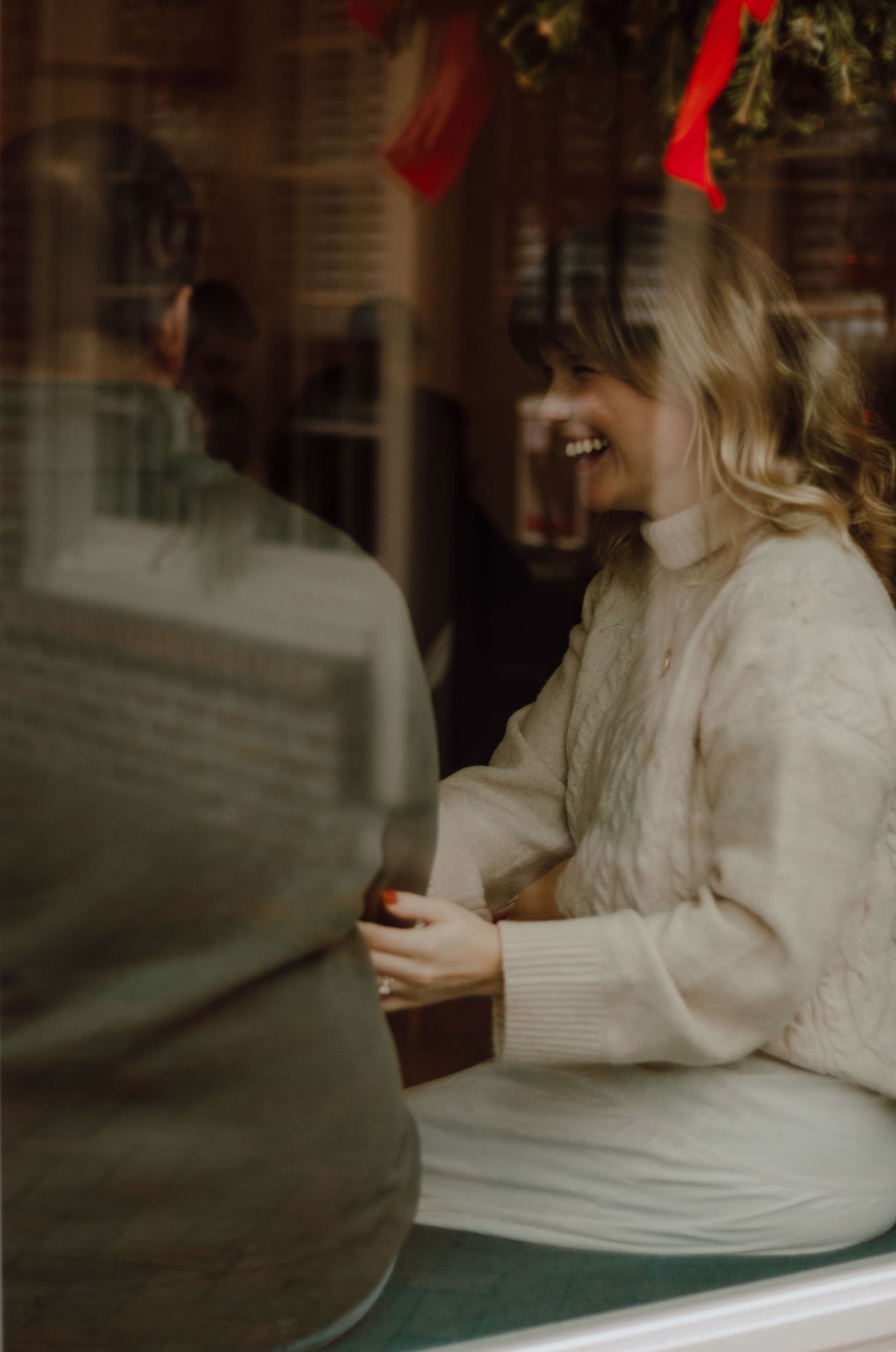 Through the window, under the wreath