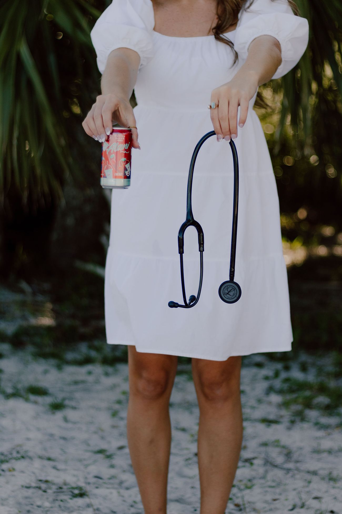 Her stethoscope over the white dress