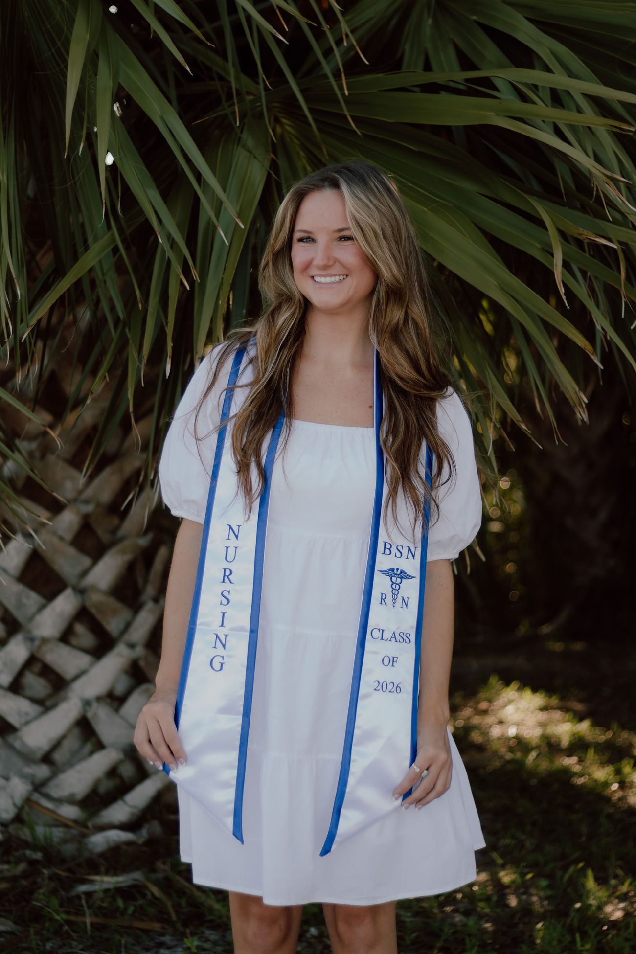 Beka in her stole under the palms