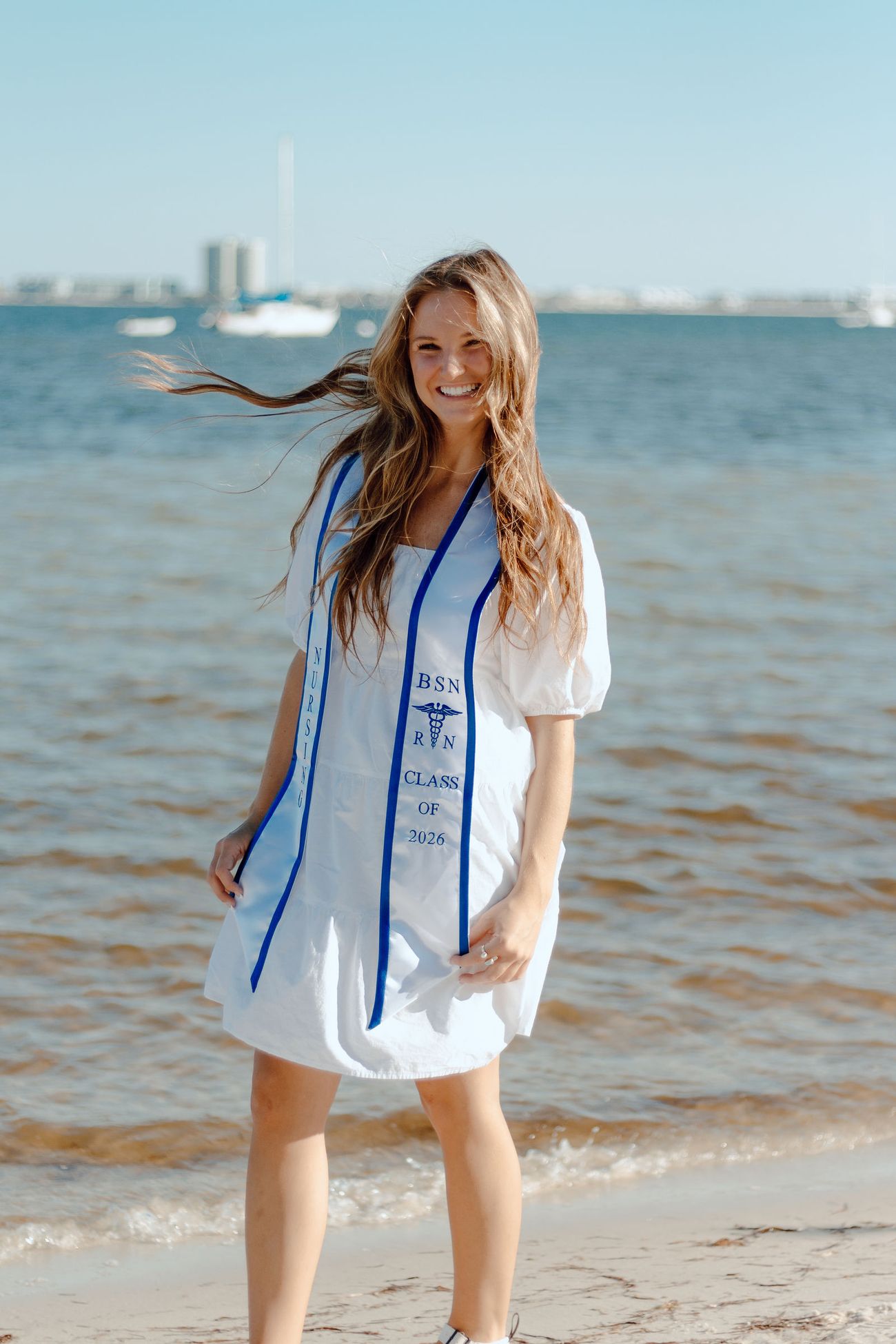 The stole, the water behind her