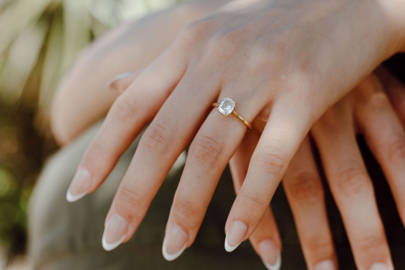 Her ring, his hand