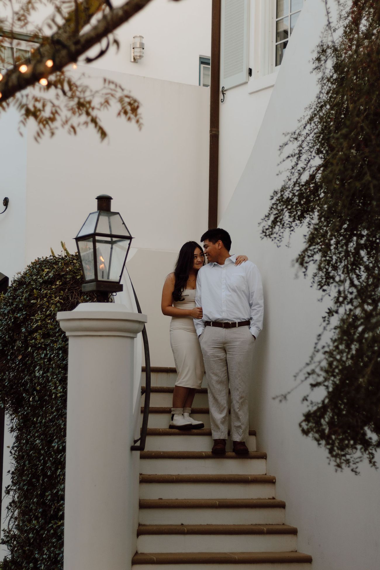 On the white stairs by the lantern