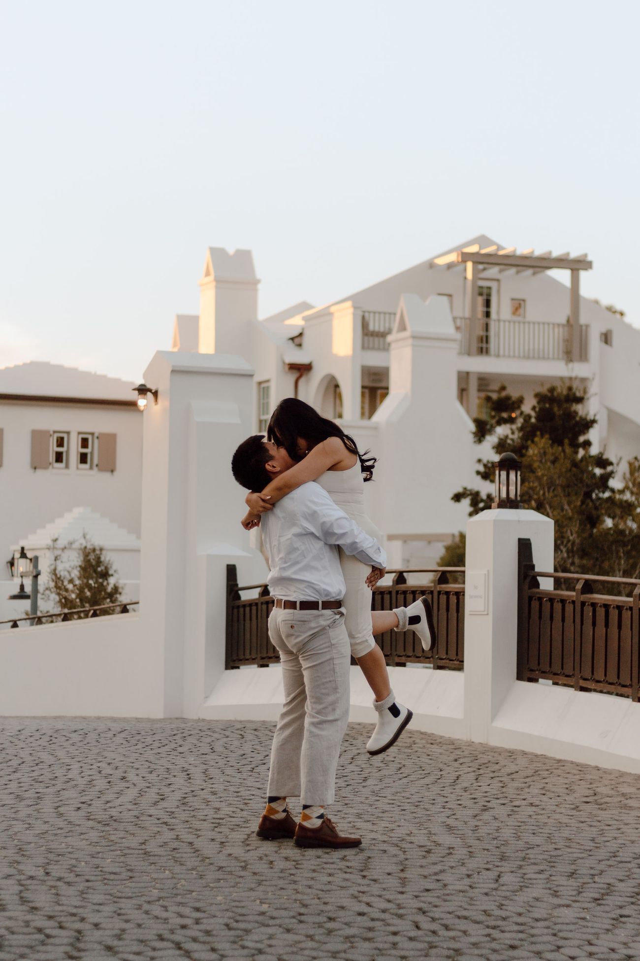 Kervin lifting Angel off the cobblestones