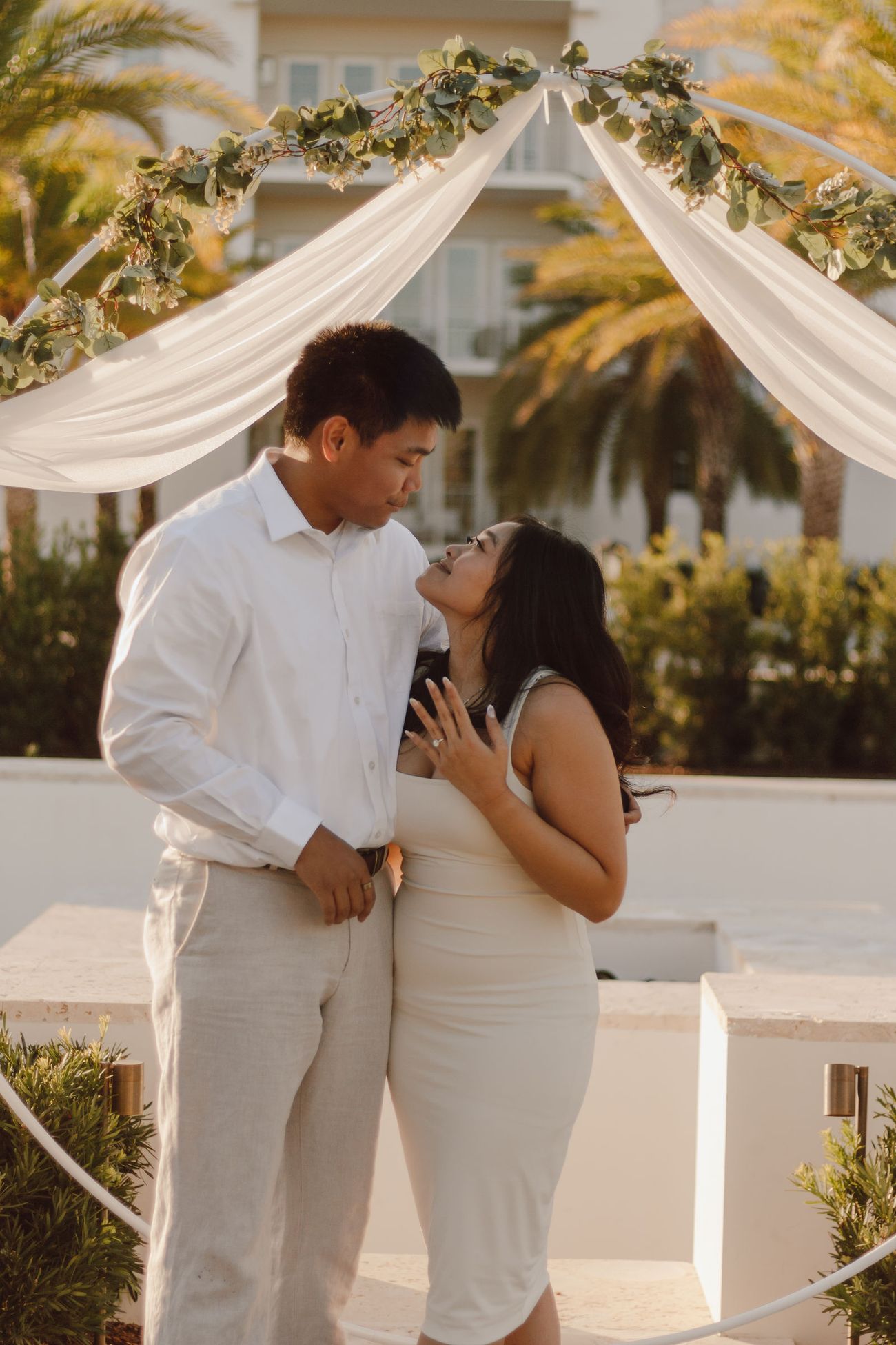 Under the arch, forehead to forehead