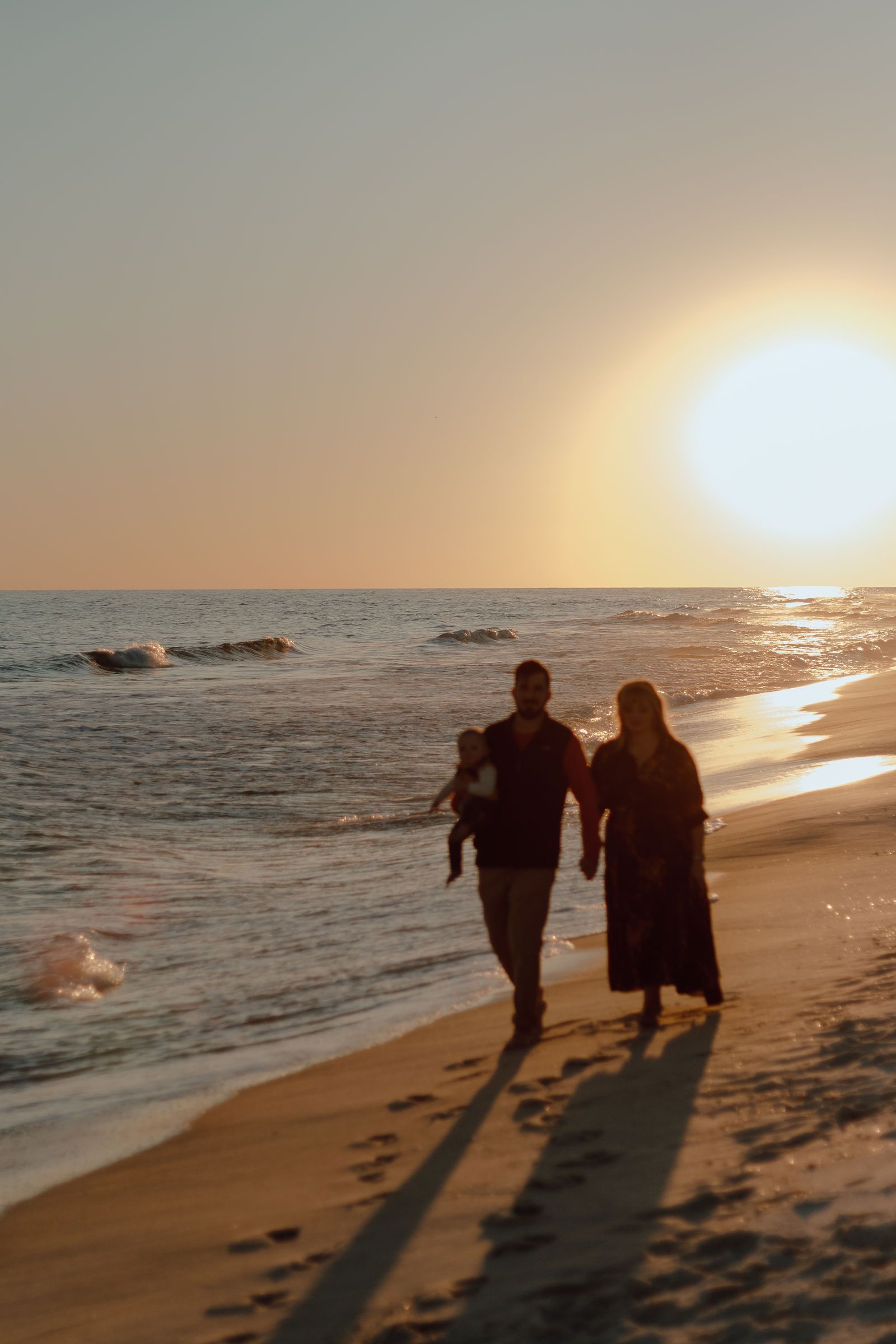 Walking the shoreline at sunset