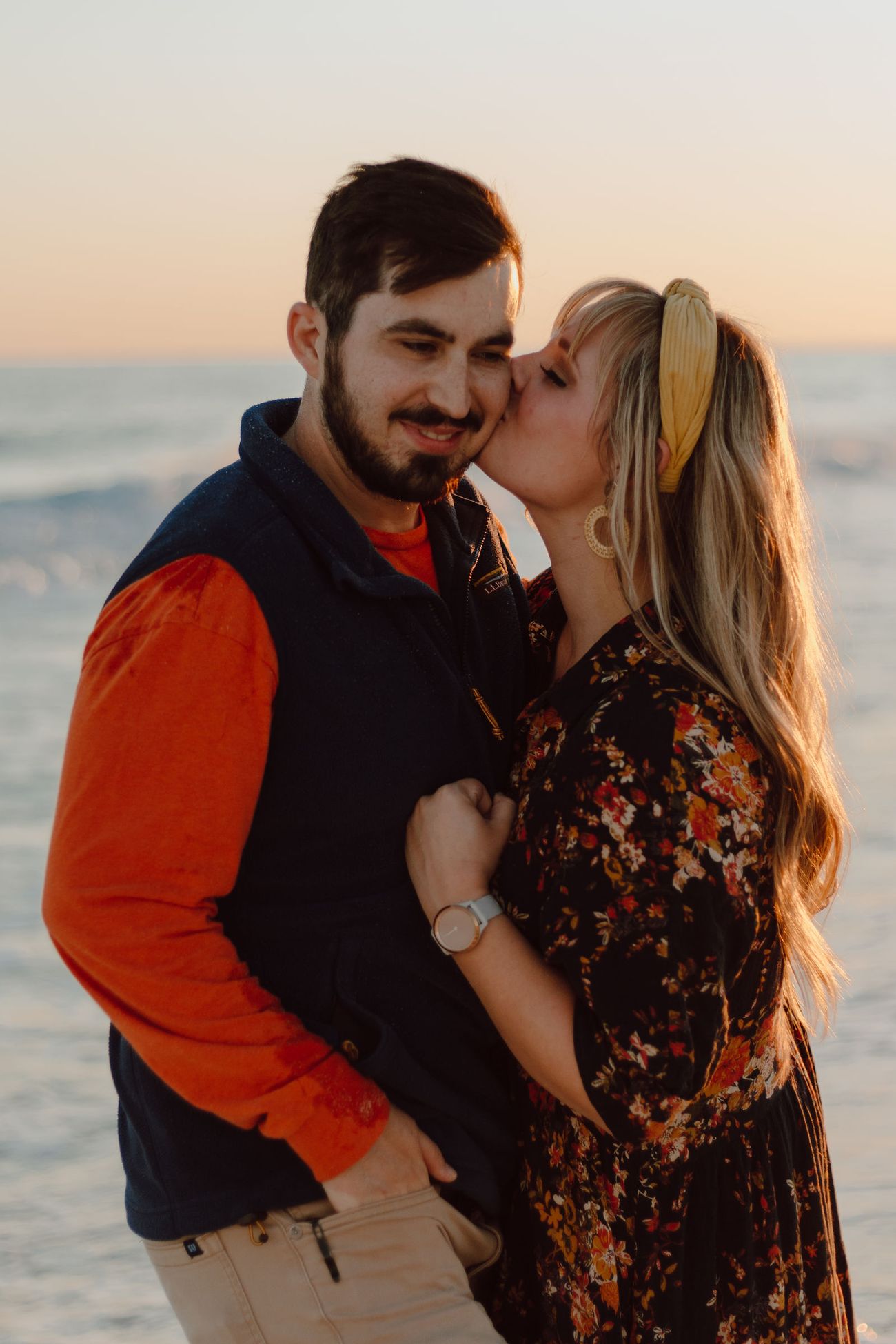 Mom and dad kissing by the water