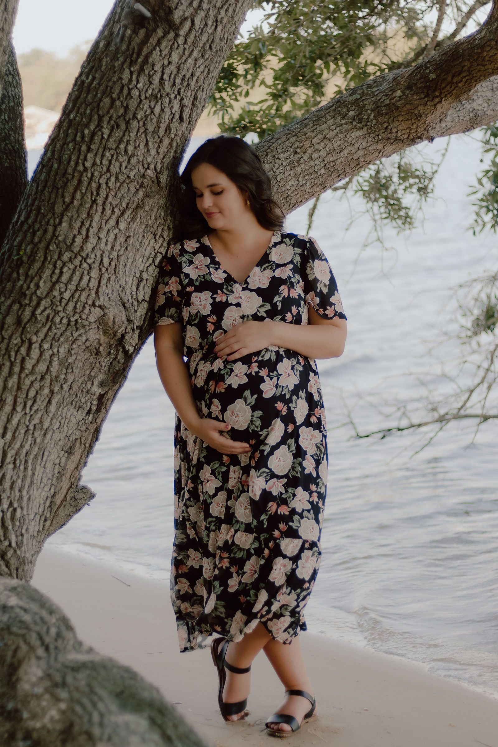 Leaning on the oak that reaches over the water
